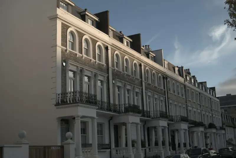 A row of white Victorian terraced houses in London